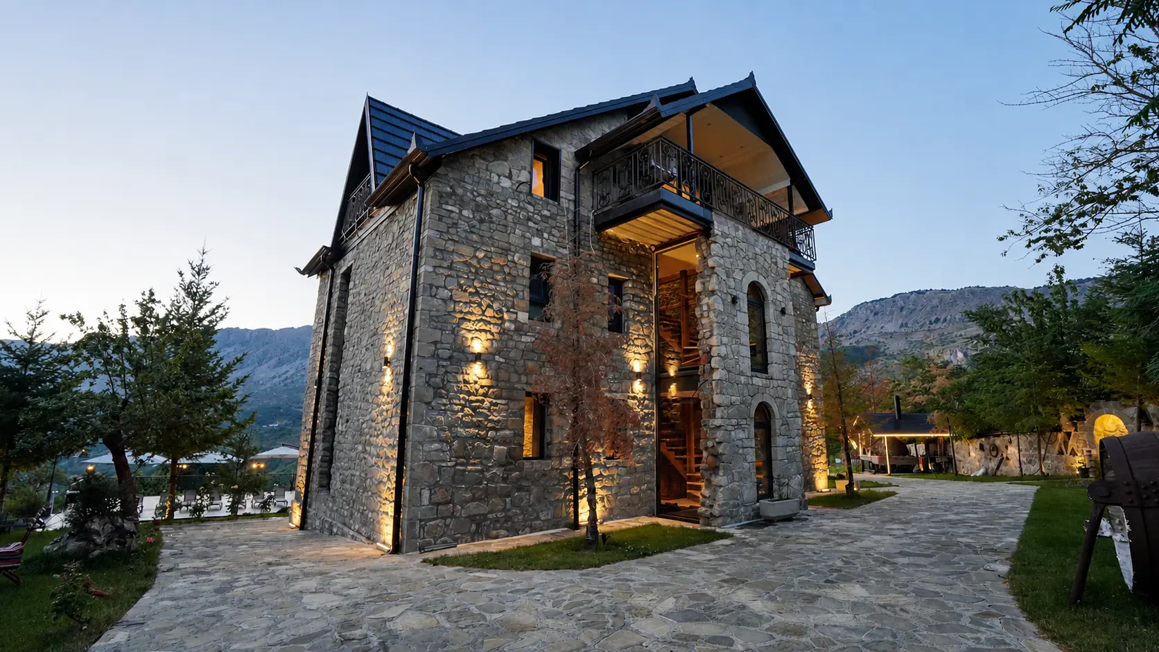 Stone building of Villa Maxhaku at dusk