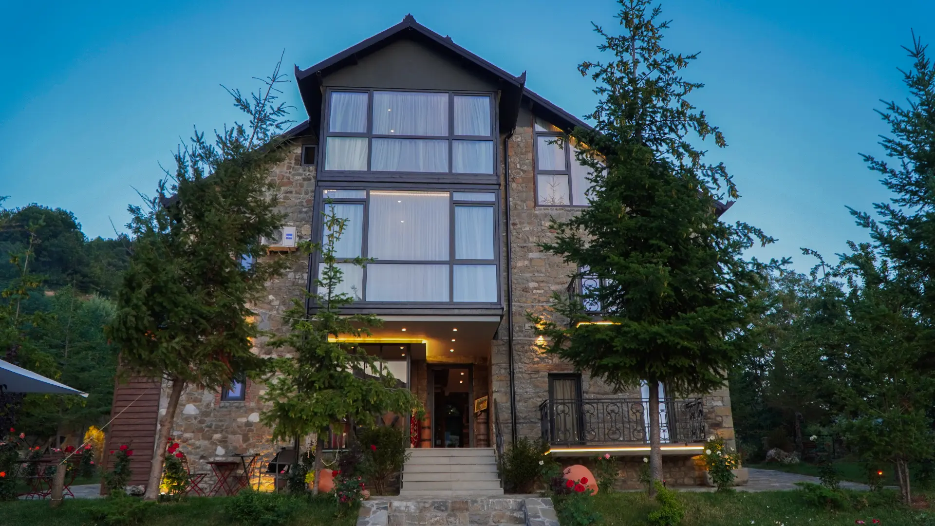Front of Villa Maxhaku with large glass windows