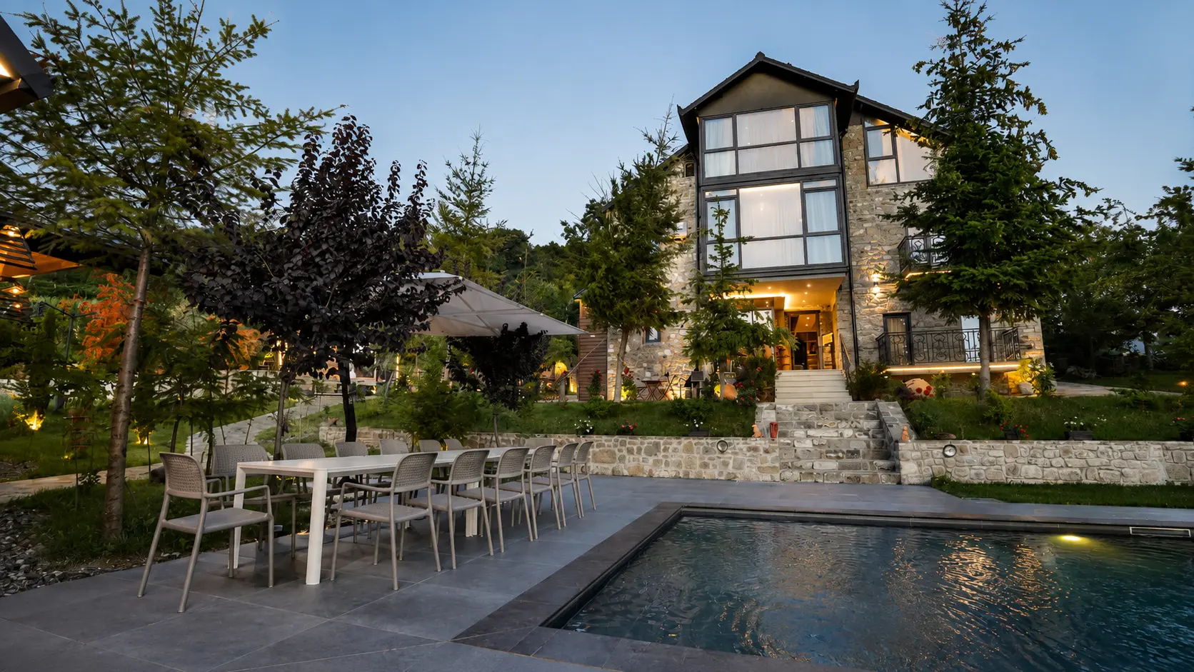 Outdoor dining table beside the pool